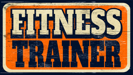 Fototapeta premium Aged and worn fitness trainer sign on wood