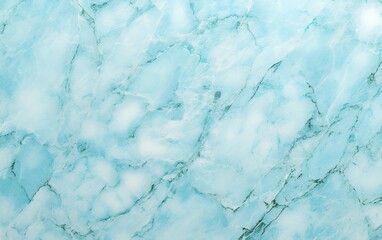Close-up of a smooth, light blue marble surface with intricate veining.