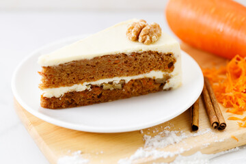 Slice of sweet carrot cake. Closeup.