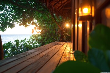 Fototapeta premium Serene view from a wooden deck overlooking the ocean at sunset, surrounded by lush greenery and warm glowing lanterns.