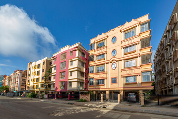 Residential multi-storey apartment buildings with city road at Rajarhat area of Kolkata, India.