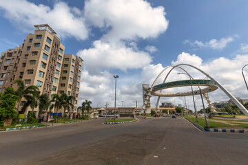 Biswa Bangla Gate, an amusement center at Rajarhat along with view of mutistory apartment buildings and city road at Kolkata, India.