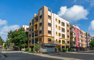 Residential multi-storey apartment buildings with city road at Rajarhat area of Kolkata, India.