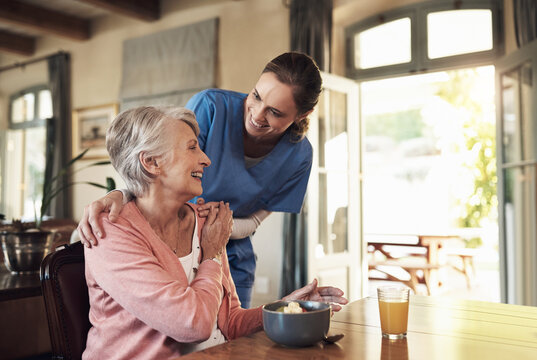 Food, helping and nurse with senior woman in assisted living facility with healthy breakfast for nutrition. Happy, talk and caregiver with elderly female patient for morning meal in retirement home. - Powered by Adobe