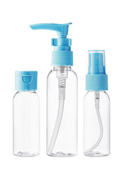 Clear plastic bottles with blue pumps and spray tops arranged on a white background