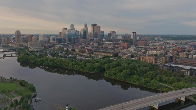 4K Rotating Drone Shot of Bassett Creek Outfall Entrance and Minneapolis Skyline