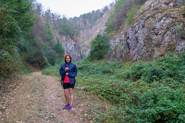 Woman hiker in a rainy day