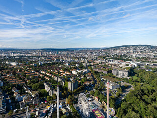 Fototapeta premium Aerial view of Swiss City of Zürich with fun fair named Knabenschiessen on a sunny late summer afternoon. Photo taken September 6th, 2024, Zurich, Switzerland.