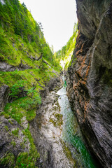 Nature in the Tiefenbachklamm between Kramsach and Brandenberg. Landscape with a river and rocks in the Alpbachtal.
