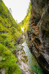 Nature in the Tiefenbachklamm between Kramsach and Brandenberg. Landscape with a river and rocks in the Alpbachtal.
