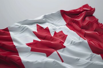 A highly detailed Canadian flag with a slight wave effect on a solid light gray background, emphasizing the flag's vibrant colors.