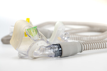 Respiratory mask for sleep disorders isolated over white. Apnea. Air pump. Assisted breathing.