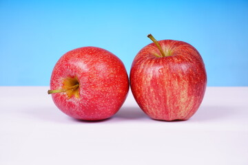 Bright red apple with a glossy surface. Food concept