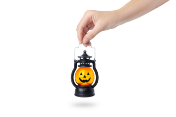 Halloween pumpkin lamp in a woman's hand. Halloween autumn concept. Isolated  on white or transparent png background