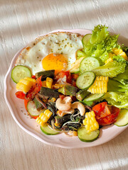 Sunny side up egg with salad for breakfast. Delicious food. Cooking recipes. Healthy recipe. Healthy meal. Bruch menu. Diet food. Healthy recipes. Easy home cooking. Happy holidays. Diet food dish.