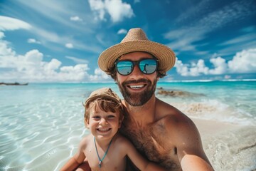 Obraz premium Father and son taking selfie on sunny beach vacation
