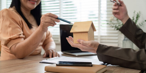 Fototapeta premium Real Estate Agent Advising Client on Home Purchase Commitments for Future Stability