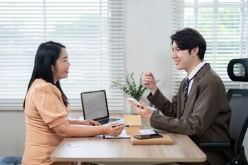 Real Estate Agent Consulting with Client on Property Market Trends for Informed Home Buying Decisions