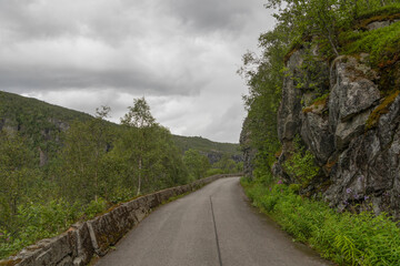 Disused stretch of road in wild Norwegian mountain landscape. The road was closed due to a high risk of landslides, 