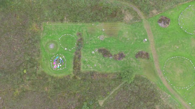 Aerial view of a group of women worshipping at the Beaghmore Stone circles at Blackrock Road by Cookstown in County Tyrone, Northern Ireland