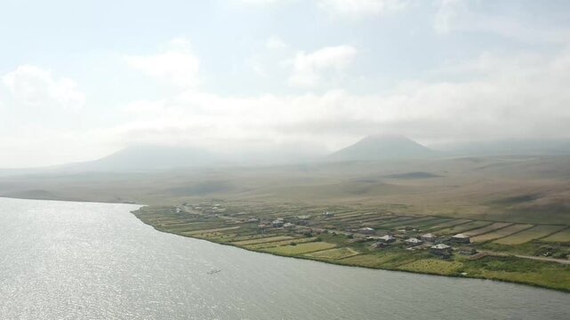 Misty Sky Over The Volcanic Lake Of Paravani In Georgia. Aerial Shot