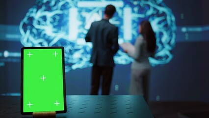 Green screen tablet used by computer scientists in startup doing advancements in AI field....