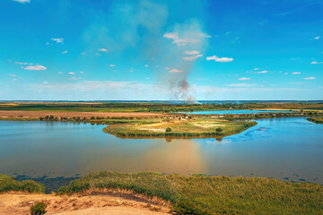 Aerial shot of wildfire in countryside landscape, drone pov