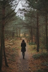 Woman Walking Down Woodland Path