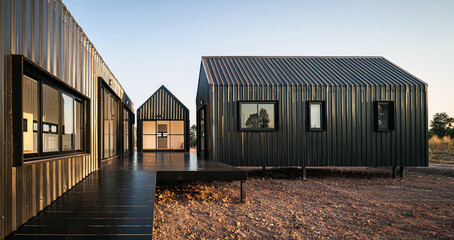 Architecture details of modern black metal sheet facade storage house with gable roof minimal style