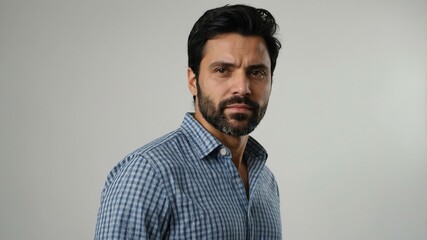 Fototapeta premium adult black hair european man in blue shirt model portrait standing straight on a plain white background for ad concept space for text