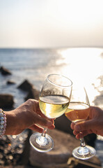 Glasses of wine on the seashore. Selective focus.