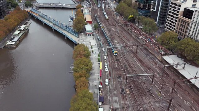 4K aerial footage of the yara river and the flinders train station in Melbourne