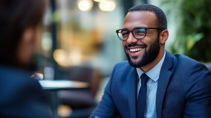Fototapeta premium Smiling Businessman in Suit and Glasses Looking at Someone