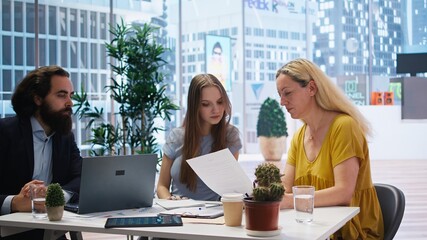 Financial adviser assisting clients in setting up investment accounts, transferring assets and...