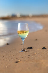 Glasses of wine on the seashore. Selective focus.