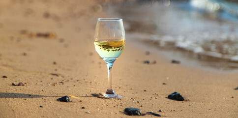 Glasses of wine on the seashore. Selective focus.