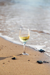 Glasses of wine on the seashore. Selective focus.