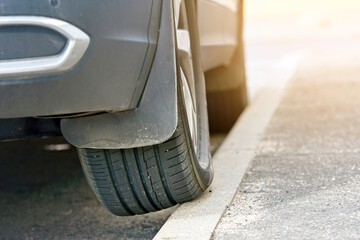 Parked car with one wheel on curb. Poor driving, incorrect parking. Wheel on curb, traffic...