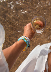 Glasses of wine on the seashore. Selective focus.