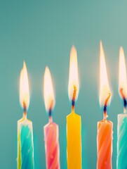 A birthday lit candles on it on pastel background.