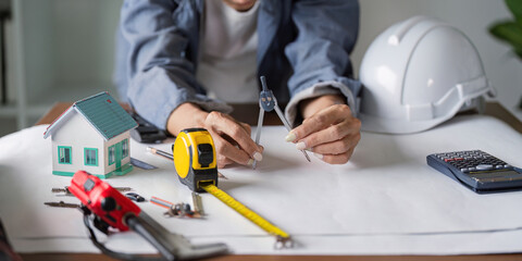 Architect Utilizing Modeling Tools for Accurate Construction Blueprint Designs