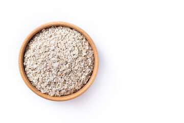 Rolled oats, healthy breakfast cereal oat flakes in bowl isolated on white background. Top view. Copy space