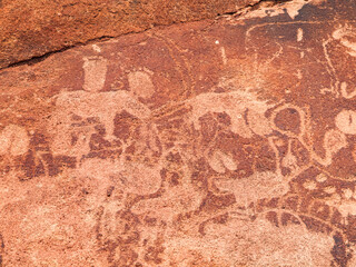 Twyfelfontein in Namibia features ancient Bushman engravings, depicting wildlife and human figures etched into the rock surface, reflecting the rich cultural history of the region.