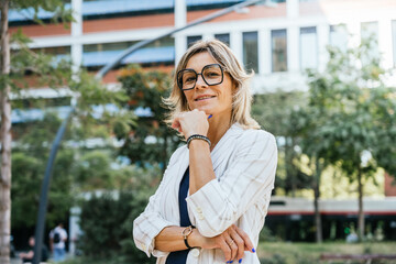 Fototapeta premium Confident Businesswoman with Hand on Chin