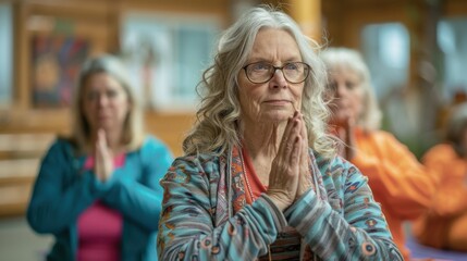 A group of older women participating in a yoga class at a community center, promoting health and well-being.