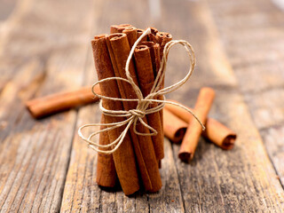 Close-Up of Cinnamon Sticks on Wooden Background – Aromatic Spice