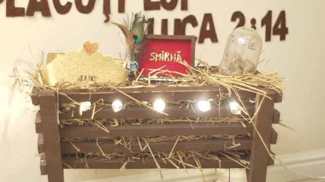Christmas decoration. Manger with straw. Gold, Myrrh and Incense