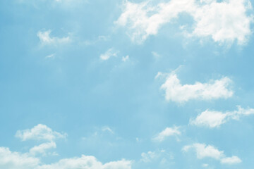 Blue pastel sky with white fluffy cloud. Cumulus clouds background. Cloudscape morning sky. The concepts of freedom of life, never give up and positive though energy.	

