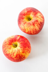 Closeup of ripe organic red apple on white table background. Selective focus.