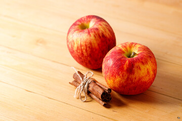 Ripe organic red apple on wooden table background.